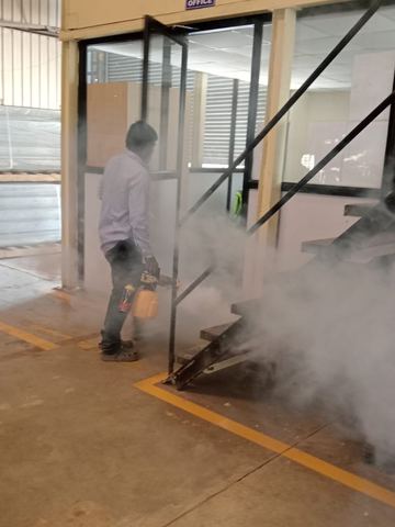 Fog filling an office corridor during a scheduled treatment