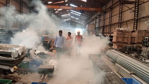 Tezz Pest Control technician fogging a large warehouse in the Pune region